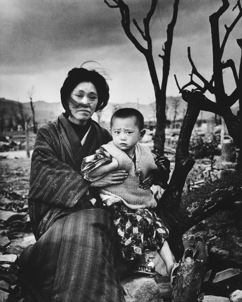 black and withe photo of devasted mother and child in Hiroshima, Japan, December 1945.