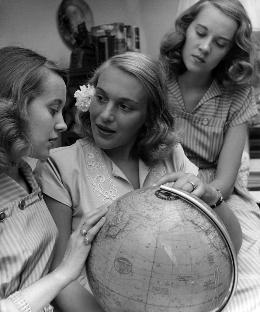 Identical twins, Betty and Barbara Bounds with a friend.